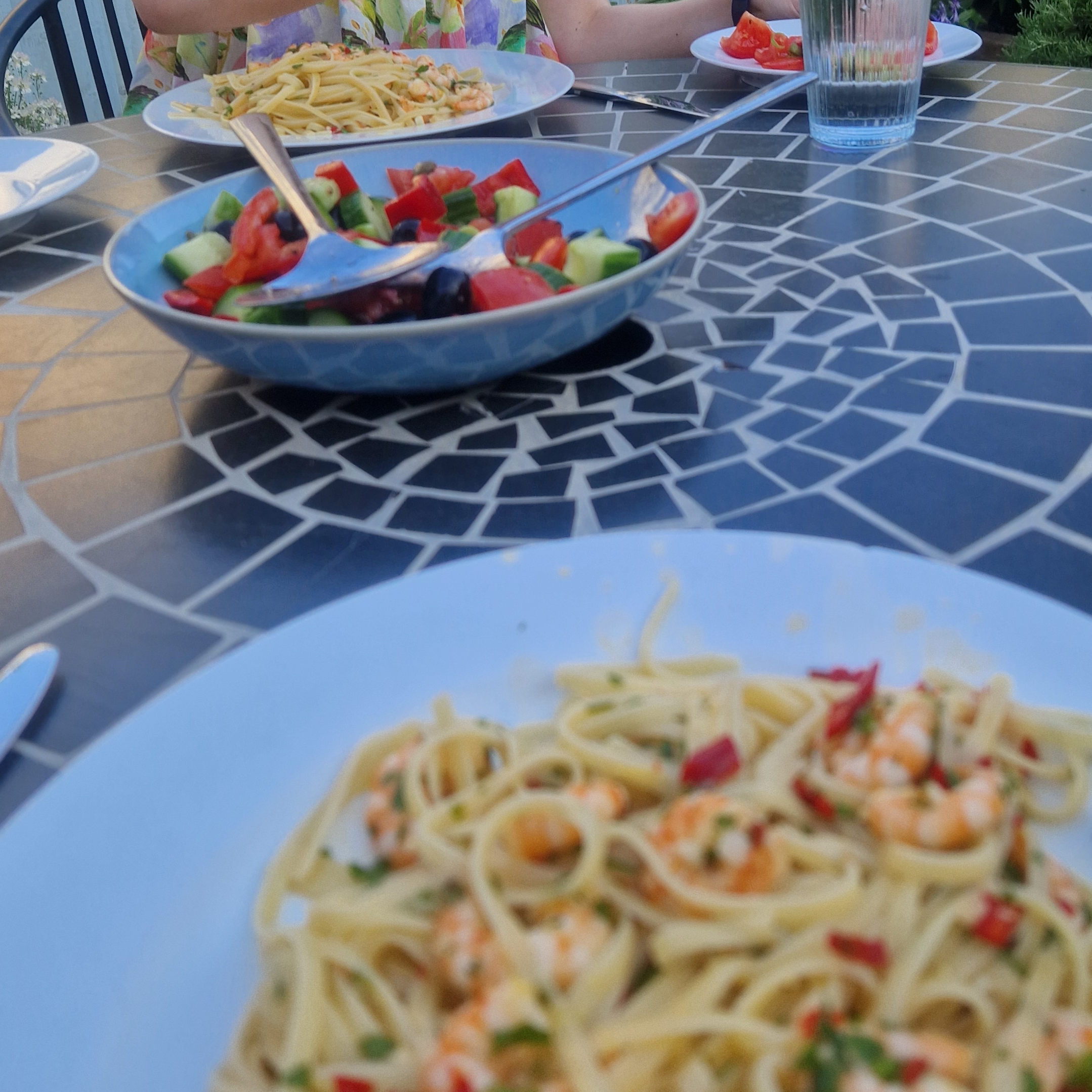 Prawn pasta with cucumber, bell pepper and olive salad