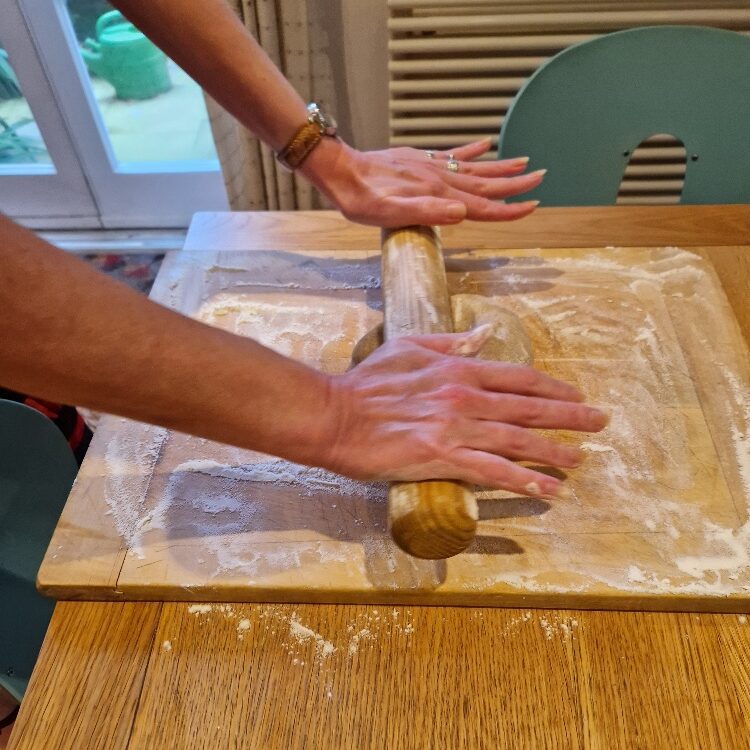 Emily rolling dough