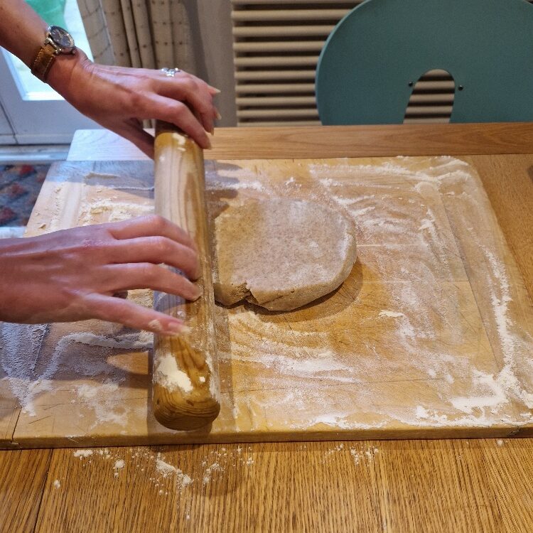 Emily rolling dough