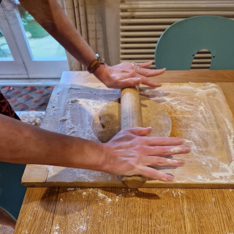 Emily rolling dough