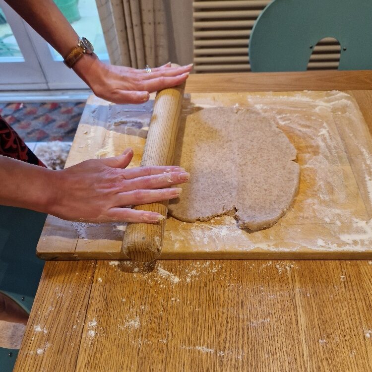 Emily rolling dough