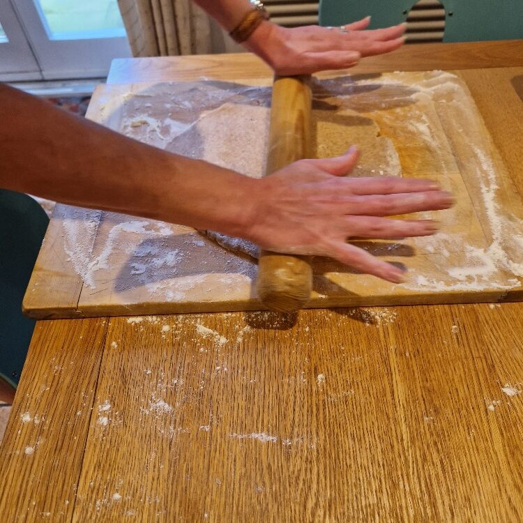 Emily rolling dough
