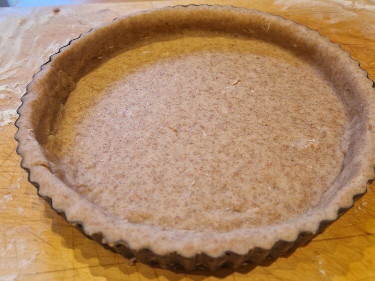 The finished pastry-lined tart tin