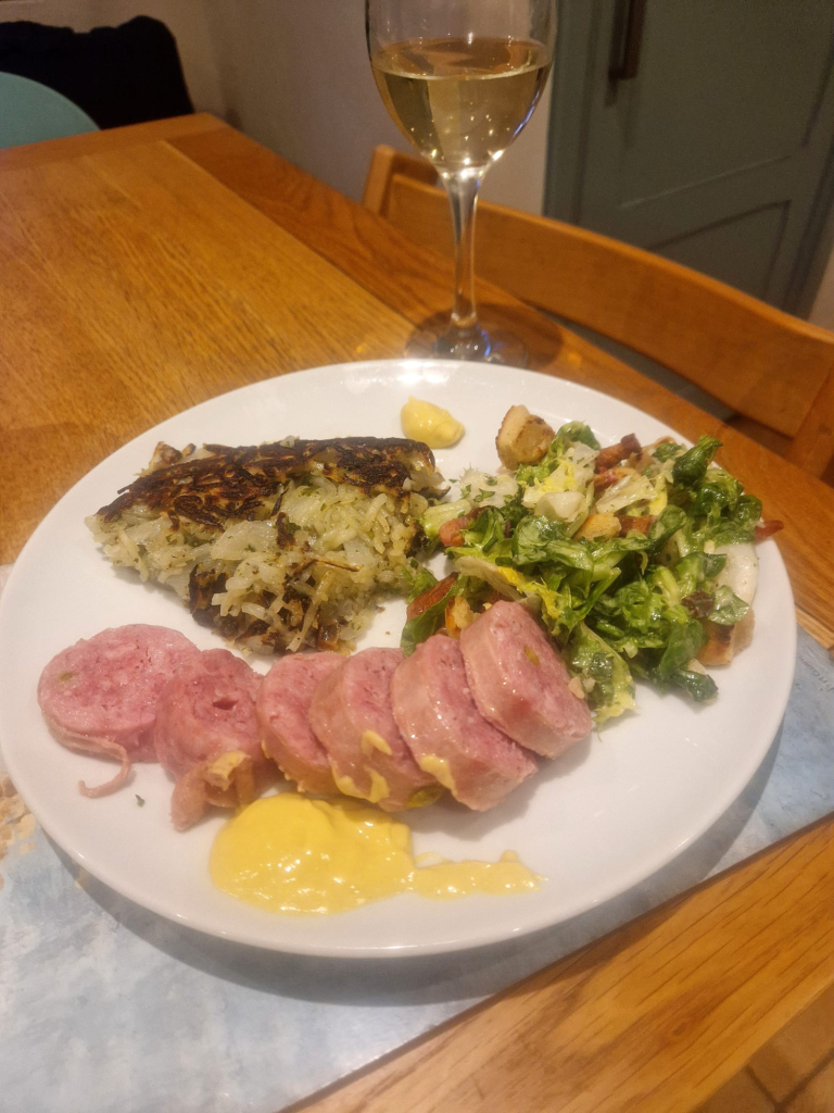 Lyon sausage with crique Arcdehoise, mustard and s glass of wine