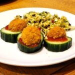 picnic eggs with cucumber slices on plate